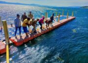 Dinas Pertanian Dairi Tabur Ribuan Bibit Ikan di Tao Silalahi 