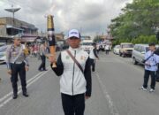 Polres Simalungun Kawal Kirab Api PON XXI Tahun 2024 Aceh-Sumut dengan Lancar dan Meriah
