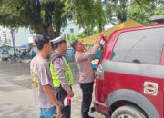 Polsek Kualuh Hulu Bagikan Ratusan Bendera Merah Putih Sambut HUT Ke-80 RI, Ajak Warga Kobarkan Semangat Nasionalisme 